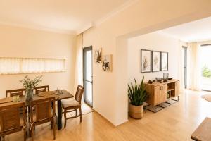 a dining room with a table and chairs in a room at Villa Emilie in Kaş