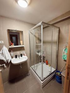 a bathroom with a shower and a sink at Sky & Sea View Apartment Budva in Budva +7 photos