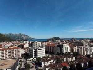 an aerial view of a city with buildings at Sky & Sea View Apartment Budva in Budva