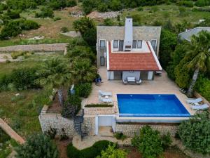 an aerial view of a house with a swimming pool at Villa Emilie in Kaş