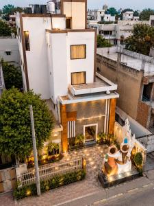 an aerial view of a building with lights at Hotel Boston Rooms by SOT - Affordable Stay near Taj #Parking #Ac #2 min drive to Taj in Agra
