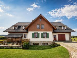 a large house with a gambrel roof at Férovka in Jeseník