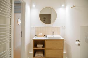 a bathroom with a sink and a mirror at Sweet Coffee Stay Apartments in Hasselt +76 photos