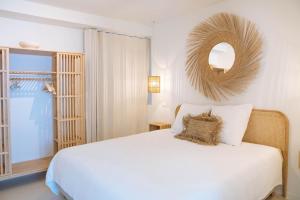 a bedroom with a white bed and a mirror at Sweet Coffee Stay Apartments in Hasselt