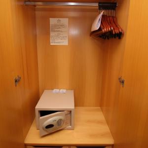 a microwave oven sitting on top of a table at 1309 - Hotel & Residence Sol Alphaville Flat in Barueri
