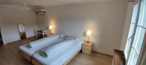 a bedroom with a bed with two pillows on it at Gasthaus Stausee in Innerthal
