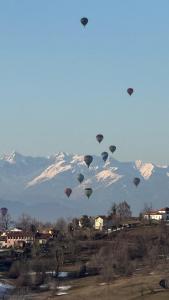 a bunch of hot air balloons flying in the sky at Santo Stefano Resort - Suite 600 - Vicoforte in Vicoforte