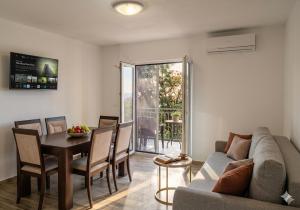 a living room with a couch and a table at Отрада in Utjeha