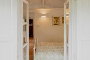 a bedroom with a bed in a room at Casa Lucia Green Cottage in Corfu