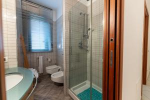 a bathroom with a shower and a tub and a toilet at Il Bergamotto in Bitritto +33 photos