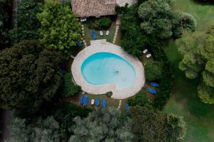 an overhead view of a pool with chairs and trees at Casa Lucia Green Cottage in Corfu