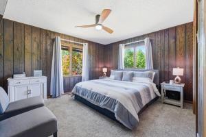 a bedroom with a bed and a ceiling fan at Hiwassee Lake Lodge - Private Mtn-Top Retreat - Lake Views - Sleeps 14 in Murphy