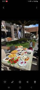 a table with plates of food on it at Likya 202 in Demre