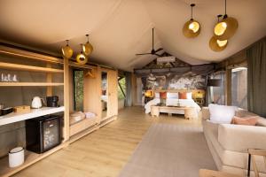 a living room with a couch and a bedroom at 18 On The Hill in Mica +104 photos