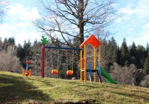 a playground on a hill in a field at Bakuriani Valley 09 in Bakuriani
