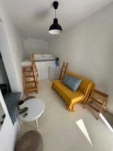 a small room with a bed and a table at Serenity Nest Serifos in Serifos Chora +10 photos