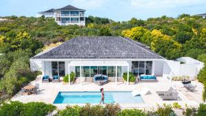 an aerial view of a house with a swimming pool at Sailrock South Caicos, Small Luxury Hotels of the World in South Caicos