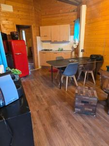a kitchen with a table and chairs in a room at La Baita di Lusso Bagnone in Bagnone +5 photos