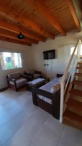 a living room with two beds and a couch at Los Nogales de Tatash in Centenario