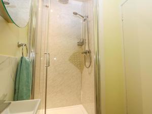 a shower with a glass door in a bathroom at Lightkeepers Fold in Eyemouth +35 photos