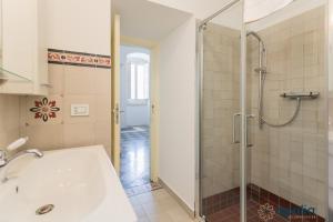 a bathroom with a shower and a sink at Villa Stone and Sea Escape by Apulia Accommodation in Cozze +51 photos