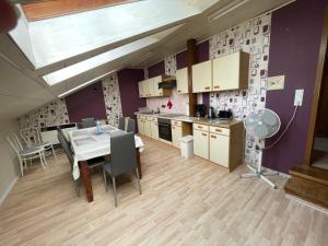 a kitchen and dining room with a table and chairs at Ferienwohnung in Weilburg in Weilburg