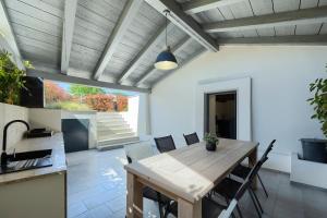a dining room with a wooden table and chairs at Villa Pepa by Istra Vacation in Pazin
