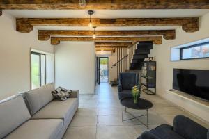 a living room with a couch and a tv at Villa Pepa by Istra Vacation in Pazin