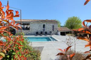 a villa with a swimming pool and a house at Villa Pepa by Istra Vacation in Pazin
