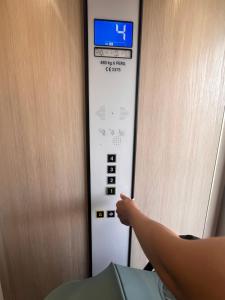 a persons foot sticking out of an elevator door at Cala Llobeta in Calafat