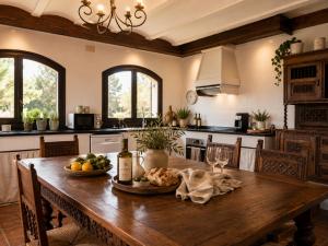 a kitchen with a wooden table with food on it at Le Mirage in Cambrils