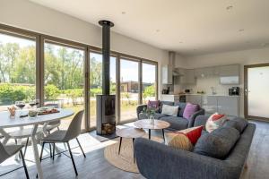 a living room with a couch and a table at 2 Bed in Colchester oc-82397 in East Bergholt +9 photos