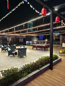 a pavilion with a ping pong table and a ping pong table at Ocean Delight Boutique Hotel 海悦精品酒店 in Sihanoukville