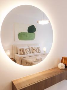 a room with a bed and a mirror at NUA Apartments in Ulcinj +30 photos