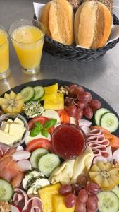 a tray filled with different types of vegetables and bread at Zimmer-Enjoy in Altenahr