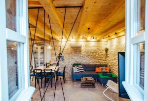 a living room with a blue couch and a table at Mala House - Šolta Island in Grohote