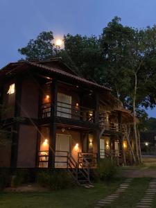 a large building with a light on top of it at Chalés Casa de Vidro in Alter do Chao