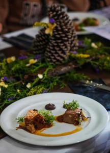 a white plate with food on top of a table at Centro Ecoturístico Rancho Buenavista in Nanacamilpa