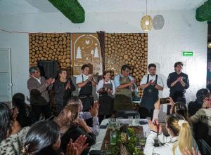a group of people standing in a room with their hands up at Centro Ecoturístico Rancho Buenavista in Nanacamilpa