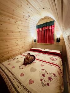 a room with a bed in a wooden cabin at Relax Della Valle in Coassolo Torinese +39 photos
