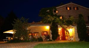a large brick house at night at Il Papavero b&b relais in Senigallia +48 photos