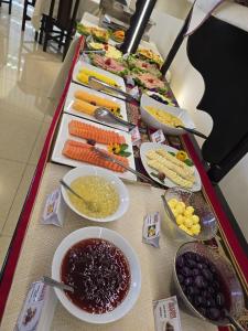 a buffet with many different types of food on a table at TerraMistica Puno Centro in Puno