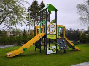 a playground with a slide in a park at Sorella House in Sianozety