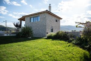 a stone house with a view of the mountains at Villa Arancia in Argos +48 photos