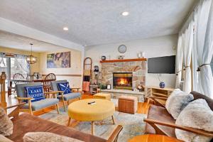 a living room with a couch and a fireplace at Lake Front Firepit Dock Game Room Pets OK in Locust Lakes Village