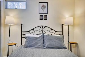 a bedroom with a bed with two lamps at Lake Front Firepit Dock Game Room Pets OK in Locust Lakes Village