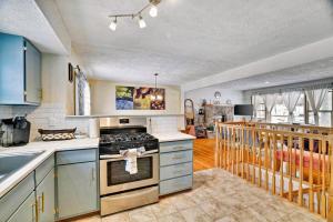 a kitchen with a stove top oven in a room at Lake Front Firepit Dock Game Room Pets OK in Locust Lakes Village