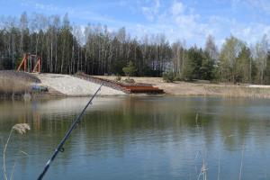 a pole in the middle of a body of water at Słoneczna Polana in Żabiczyn +3 photos