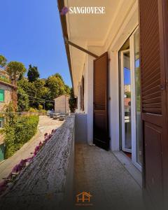 a door to a building with a view of a street at La Cameranense by Homes in Ancona in Camerano