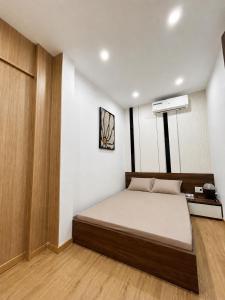 a bedroom with a large bed in a room at Linh's Home in Danang